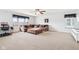 Bright living room features a large sectional, ceiling fan, and a desk with large bright window at 3132 W Meadowbend Dr, Monrovia, IN 46157