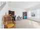 Bright, carpeted living room featuring a desk, shelving, and natural light from a large window at 3132 W Meadowbend Dr, Monrovia, IN 46157