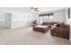 Spacious living room with a large sectional, ceiling fan, and a functional desk area at 3132 W Meadowbend Dr, Monrovia, IN 46157