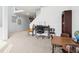 Bright living room featuring a desk area under the stairway and a variety of furniture at 3132 W Meadowbend Dr, Monrovia, IN 46157