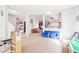 Bright, spacious playroom with plenty of room for activities, including a faux market and comfy seating at 3132 W Meadowbend Dr, Monrovia, IN 46157