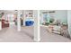 Spacious playroom features a carpeted floor, play market, bright windows, and room for a variety of activities at 3132 W Meadowbend Dr, Monrovia, IN 46157