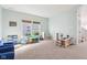 Bright playroom with natural light, cozy carpet, seating, and play store for hours of fun at 3132 W Meadowbend Dr, Monrovia, IN 46157