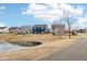 Beautiful community pond view, creating a peaceful backdrop for the surrounding homes and walkways at 3132 W Meadowbend Dr, Monrovia, IN 46157