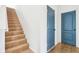 Stairway leading up to next level, paired with blue doors and tan tile entryway at 3132 W Meadowbend Dr, Monrovia, IN 46157