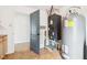 A functional utility room featuring essential appliances and a doorway leading to another room at 3132 W Meadowbend Dr, Monrovia, IN 46157
