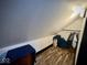Attic space with wood-look floors, built in storage and hanging rack, great for storage at 318 Congress Ave, Indianapolis, IN 46208
