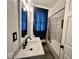 Modern bathroom with tiled shower/tub, sleek fixtures, and a stylish vanity with under-sink storage at 318 Congress Ave, Indianapolis, IN 46208