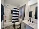 Well-lit bathroom featuring a shower and tub with marble tile and a modern sink at 318 Congress Ave, Indianapolis, IN 46208