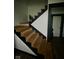 Striking wooden staircase featuring dark and light contrasting colors creates a bold, modern design element at 318 Congress Ave, Indianapolis, IN 46208