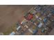 Aerial view of a home in a rural neighborhood with a large yard and nearby farmland at 323 Norris Dr, Anderson, IN 46013