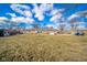 Large backyard featuring a well-maintained lawn and patio perfect for outdoor living at 323 Norris Dr, Anderson, IN 46013