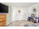 Bright bedroom featuring vinyl flooring, built-in storage, and two double-door closets at 323 Norris Dr, Anderson, IN 46013