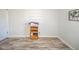 This empty room has new vinyl flooring and would be perfect for a room or home office at 323 Norris Dr, Anderson, IN 46013
