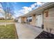 Close up view of home's entryway and facade with porch bench at 323 Norris Dr, Anderson, IN 46013