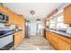 Bright kitchen featuring stainless steel appliances, light wood cabinets, and modern countertops at 323 Norris Dr, Anderson, IN 46013