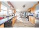 Long view of the kitchen featuring stainless steel appliances and light wooden cabinets at 323 Norris Dr, Anderson, IN 46013