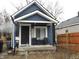 Charming blue home with a cozy front porch, ideal for enjoying the neighborhood at 3610 E 28Th St, Indianapolis, IN 46218