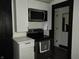 A well-organized kitchen featuring white cabinetry, stainless steel appliances, and black trim at 3610 E 28Th St, Indianapolis, IN 46218