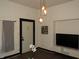 Modern living room featuring stylish lighting, dark trim and wood-look floors at 3610 E 28Th St, Indianapolis, IN 46218