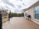 Generously sized wooden deck with sleek black railings, perfect for grilling and enjoying outdoor living at 3791 Harveys Path, Greenwood, IN 46143