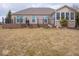 Spacious backyard featuring a tiered wooden deck, creating an inviting outdoor space for relaxation and entertainment at 3791 Harveys Path, Greenwood, IN 46143