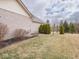 Backyard featuring a well-manicured lawn and tasteful landscaping that enhances the home's curb appeal at 3791 Harveys Path, Greenwood, IN 46143