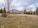 Expansive backyard featuring a spacious lawn, wooden deck, and lush landscaping for outdoor enjoyment at 3791 Harveys Path, Greenwood, IN 46143