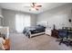 Cozy bedroom with soft carpet, neutral walls, and a ceiling fan with a light at 3791 Harveys Path, Greenwood, IN 46143