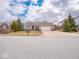 Charming single-story brick home with a two-car garage, mature landscaping and a well-manicured lawn at 3791 Harveys Path, Greenwood, IN 46143