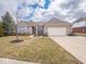 Inviting single-story brick home featuring manicured flower beds, an attached two-car garage, and mature landscaping at 3791 Harveys Path, Greenwood, IN 46143