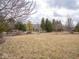 Expansive front yard showcases lush landscaping, mature trees, and a well-maintained lawn at 3791 Harveys Path, Greenwood, IN 46143