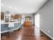 Bright and airy kitchen with stainless steel appliances and a large island with bar stool seating at 3791 Harveys Path, Greenwood, IN 46143
