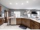 Spacious kitchen with stainless steel appliances, white countertops, and wood cabinets at 3791 Harveys Path, Greenwood, IN 46143