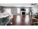 Spacious living room with hardwood floors, fireplace, and ample natural light, perfect for relaxation at 3791 Harveys Path, Greenwood, IN 46143