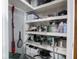 Walk-in pantry offers ample storage space with organized shelves and various kitchen essentials at 3791 Harveys Path, Greenwood, IN 46143