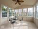 Bright sunroom with ample natural light, complemented by stylish furniture and neutral decor at 3791 Harveys Path, Greenwood, IN 46143