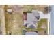 Bird's eye view of a backyard with a small garden shed, deck, and patio at 3801 S Cedar Creek Ln, New Palestine, IN 46163