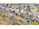 Aerial shot capturing the neighborhood's layout, showcasing well-kept yards and the peaceful neighborhood pond at 3801 S Cedar Creek Ln, New Palestine, IN 46163