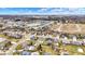 Overhead shot of a residential area featuring neatly arranged homes with landscaped yards and community green spaces at 3801 S Cedar Creek Ln, New Palestine, IN 46163