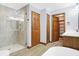 Bathroom shows a glass enclosed shower and access to a walk-in closet and hall at 3801 S Cedar Creek Ln, New Palestine, IN 46163
