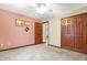 Comfortable bedroom features carpet, natural light, and double door closet at 3801 S Cedar Creek Ln, New Palestine, IN 46163