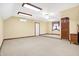 Open bedroom features a ceiling fan, neutral colored walls, and carpet flooring at 3801 S Cedar Creek Ln, New Palestine, IN 46163