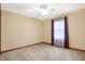 Cozy bedroom features neutral walls, carpet and window with purple curtains at 3801 S Cedar Creek Ln, New Palestine, IN 46163