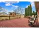 Spacious outdoor deck with dark red planks and greenery views for outdoor enjoyment at 3801 S Cedar Creek Ln, New Palestine, IN 46163