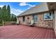 Outdoor deck with a brick surround featuring table and chairs for relaxing at 3801 S Cedar Creek Ln, New Palestine, IN 46163