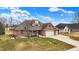 Attractive brick home with a well-manicured lawn and mature landscaping at 3801 S Cedar Creek Ln, New Palestine, IN 46163