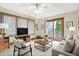 Comfortable living room with neutral tones, sliding doors to deck and wooded views at 3801 S Cedar Creek Ln, New Palestine, IN 46163