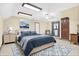 Spacious main bedroom with elegant blue accents and neutral walls and carpeting at 3801 S Cedar Creek Ln, New Palestine, IN 46163