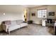Spacious bedroom with a cozy sitting area and adjacent bathroom at 3840 Knollton Rd # A, Indianapolis, IN 46228